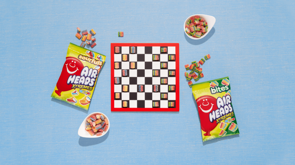 A chess game with Airheads Xtremes Bites.