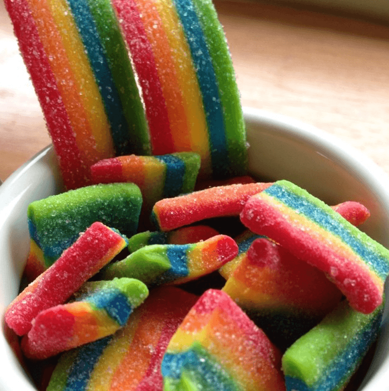 Airheads Xtremes candies that have rainbow colors in a cereal bowl.